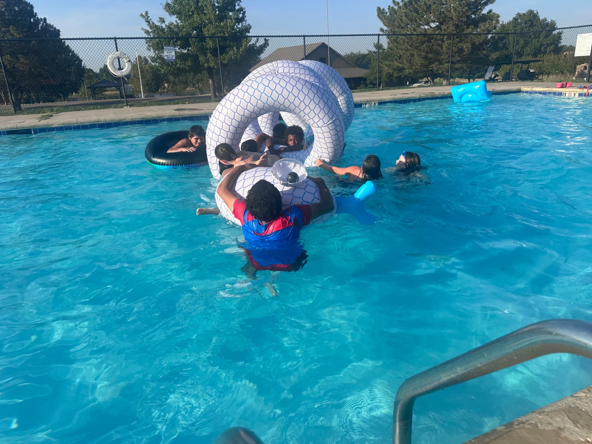 Children playing on an inflatable at the Pepper's Ranch pool