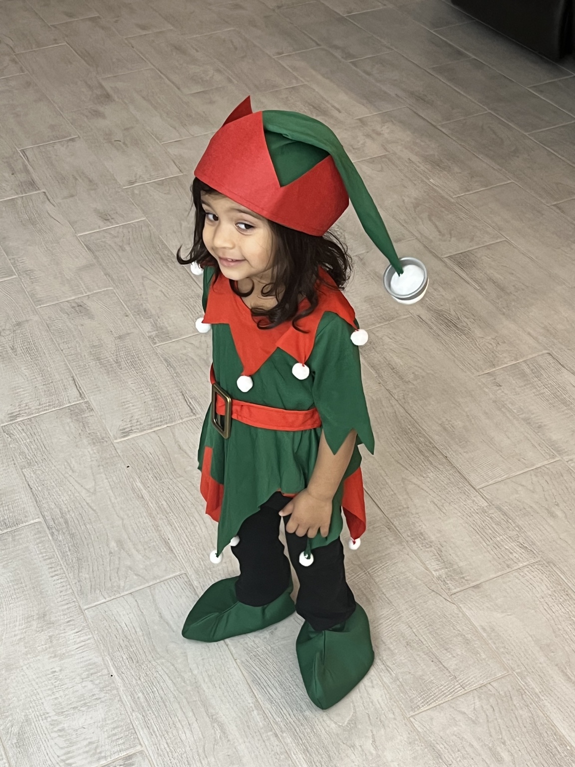 Aria in her elf costume, one of Santa's little helpers